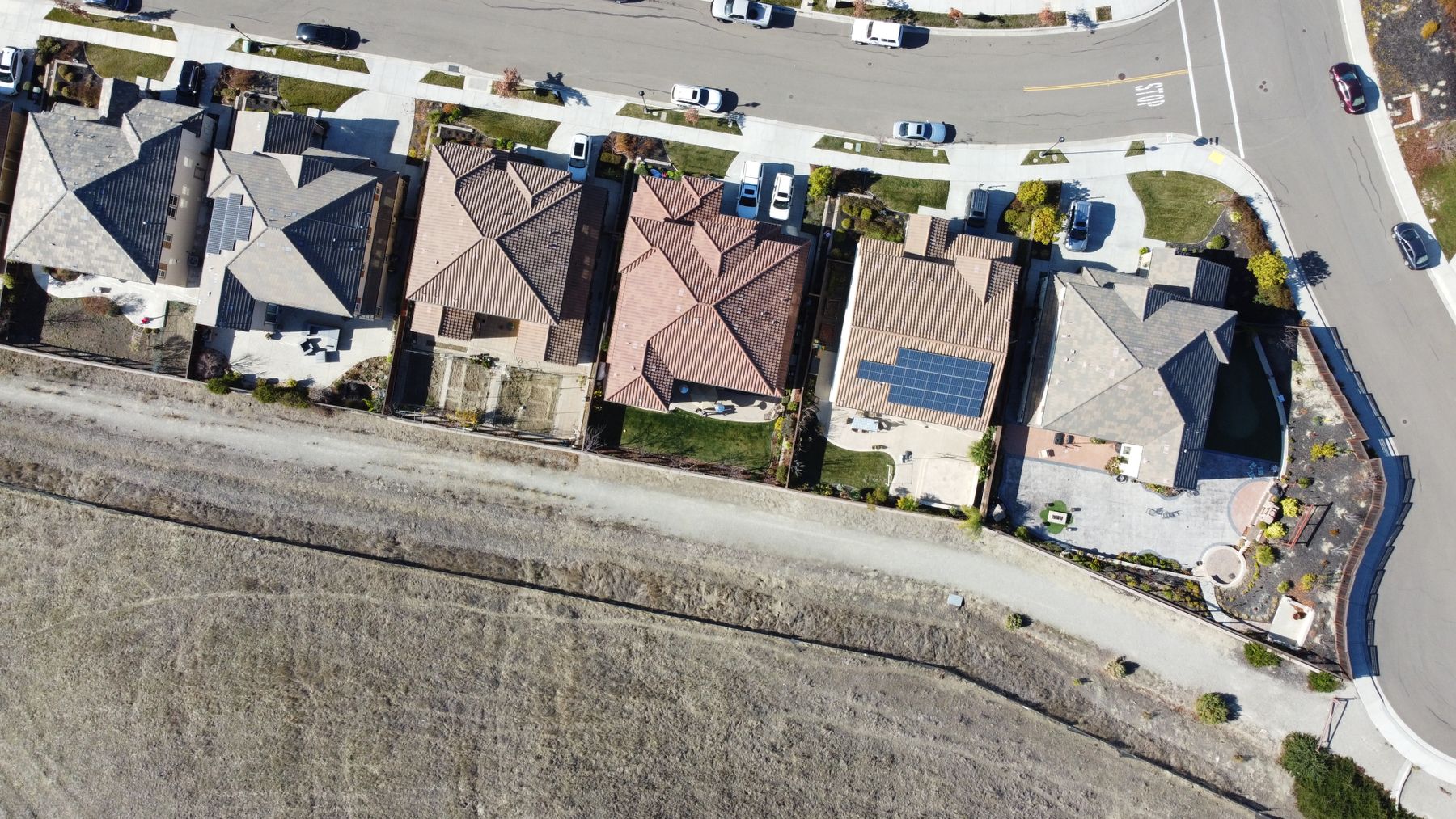 Aerial view of a California neighborhood with solar arrays across the rooftops